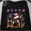 Rottweiler dog and america flag – Independence day